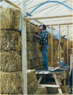 Greg Madeen constructing a strawbale structure