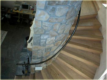 curved stairs in alternative straw bale residence