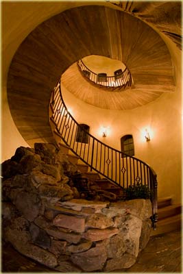 3-story spiral stairway with fountain at bottom