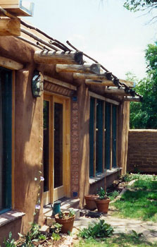 solar adobe with inexpensive shading device in historic Santa Fe, New Mexico