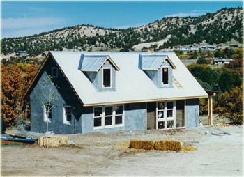 solar adobe guest house with trombe wall near Taos, New Mexico